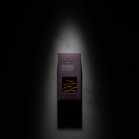 Centred unopened Salted Caramel Florentines in spotlight